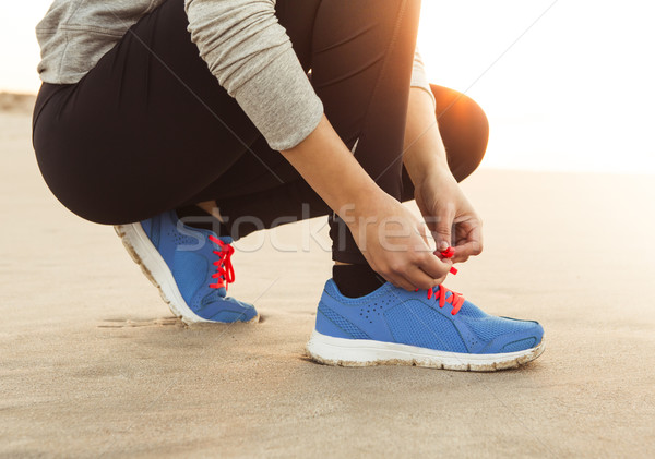 Cipőfűző futó nő nők naplemente fitnessz Stock fotó © iko