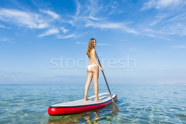 Woman practicing paddle Stock photo © iko