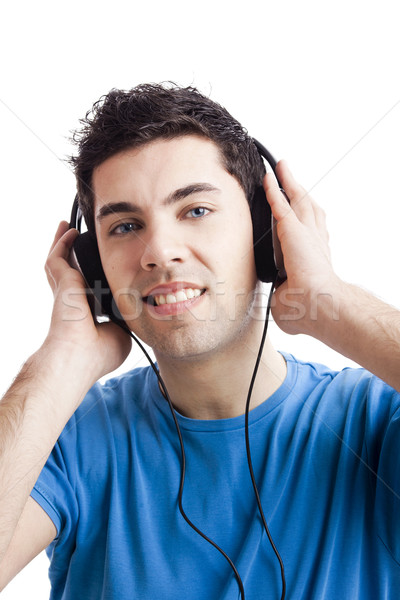 Joven escuchar música casual escuchar auriculares Foto stock © iko