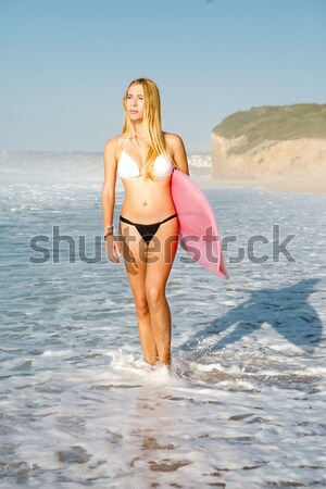 Stock photo: Surfer girl with her surfboard