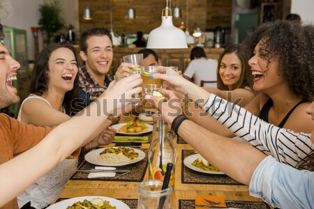 Stock photo: Friends lunching at the restaurant