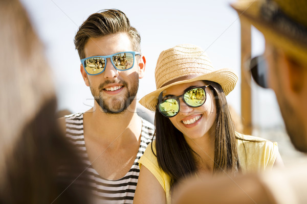 Friends at the beach bar Stock photo © iko