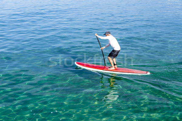 Senior man practicing paddle Stock photo © iko