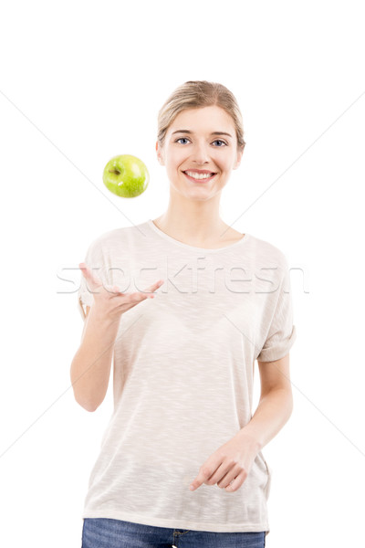 Beautiful woman throwing a green apple Stock photo © iko