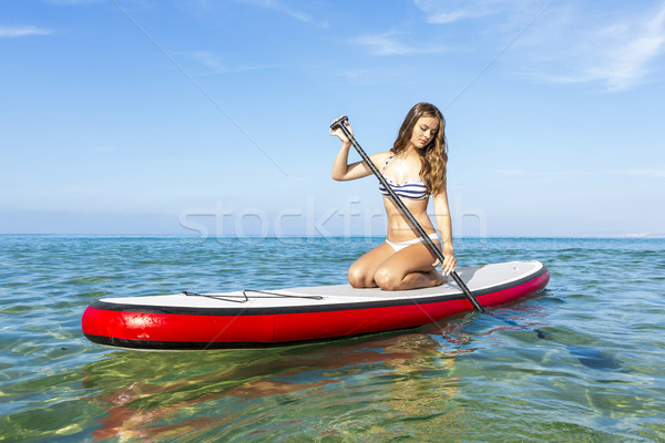 Woman practicing paddle Stock photo © iko