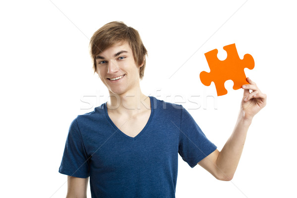 Rozwiązanie młody człowiek puzzle kawałek odizolowany Zdjęcia stock © iko