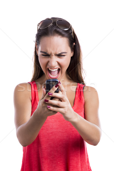 Kiabál mobiltelefon gyönyörű nő mobiltelefon izolált fehér Stock fotó © iko