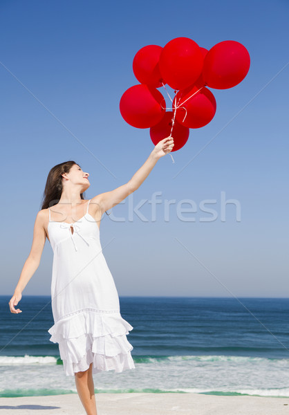 Beautiful girl holding red ballons Stock photo © iko