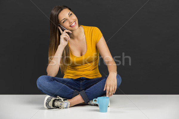 Stock photo: Woman talking at phone