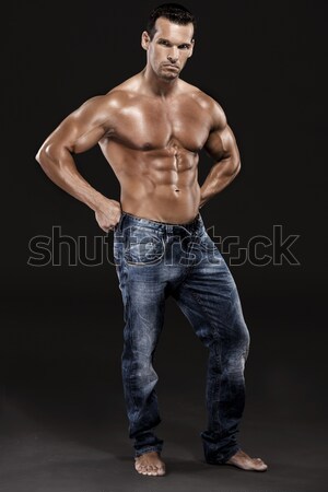 Muscle man posing in studio, isolated over a white background Stock photo © iko