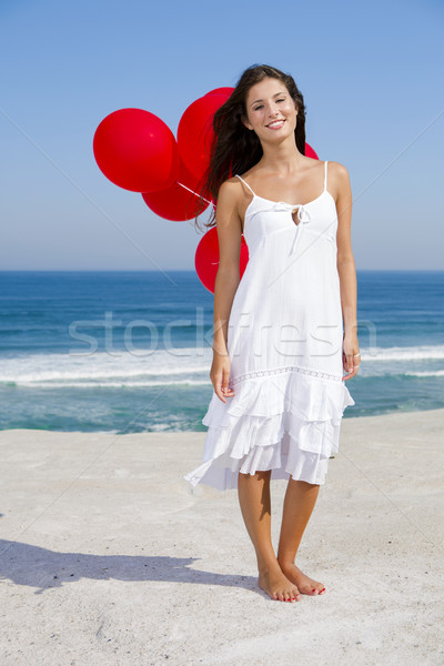 Belle fille rouge femme plage ciel [[stock_photo]] © iko