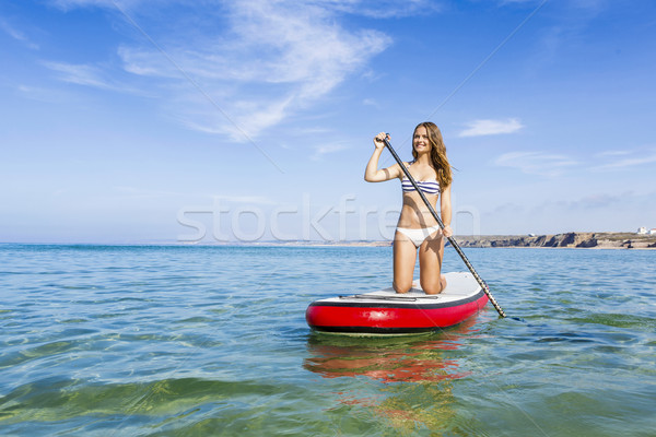 Woman practicing paddle Stock photo © iko