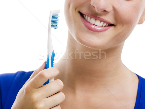 Beautiful woman with a toothbrush Stock photo © iko
