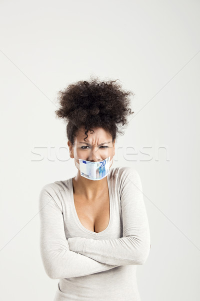 Stock photo: Covering mouth with a euro banknote