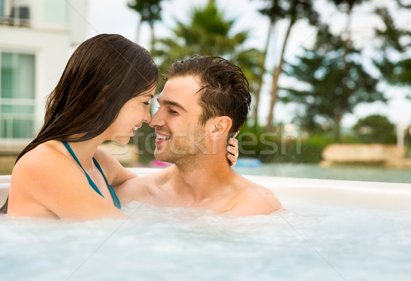 Stock photo: Young couple in a jacuzzi
