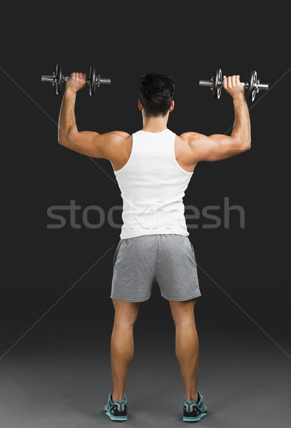 Sportlich Mann Heben Gewichte Porträt gut aussehend Stock foto © iko