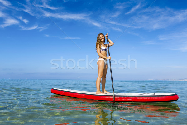 Woman practicing paddle Stock photo © iko