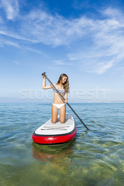 Woman practicing paddle Stock photo © iko