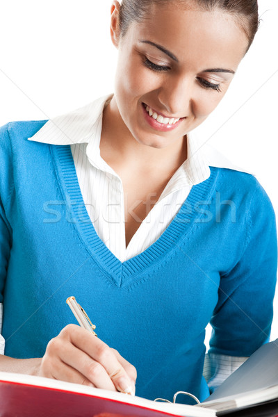 Belo feminino estudante escrita algo isolado Foto stock © iko