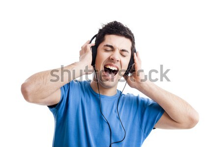 Сток-фото: молодым · человеком · слушать · музыку · случайный · прослушивании · наушники