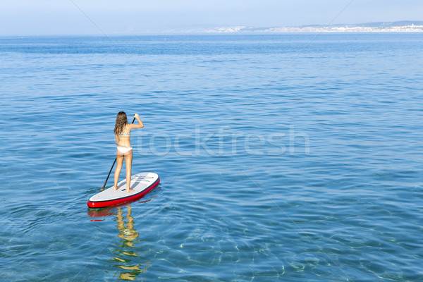 Woman practicing paddle Stock photo © iko