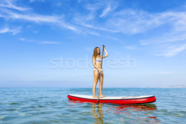 Woman practicing paddle Stock photo © iko