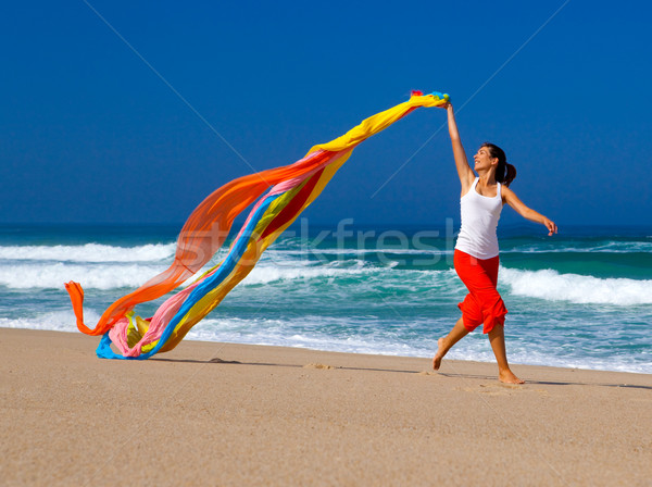 Színes gyönyörű fiatal nő fut tengerpart papírzsebkendő Stock fotó © iko