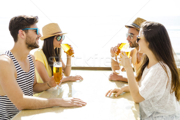 Friends drinking a cold beer Stock photo © iko