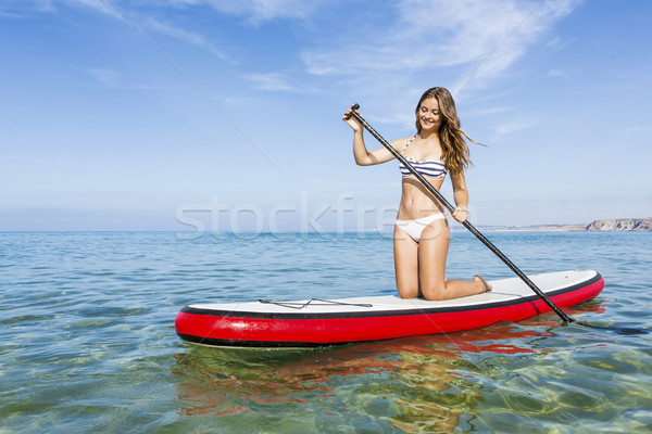 Woman practicing paddle Stock photo © iko