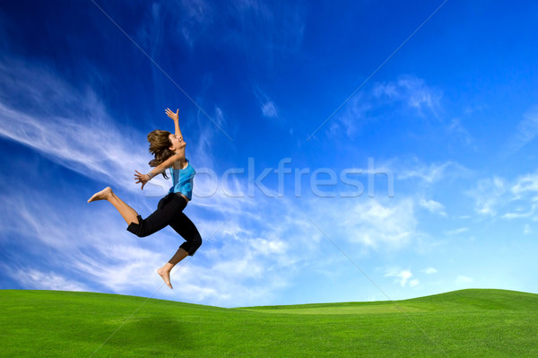 Grande Vai bella donna jumping Foto d'archivio © iko