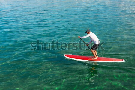 Senior man practicing paddle Stock photo © iko