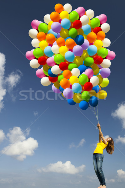 Dziewczyna kolorowy balony szczęśliwy młoda kobieta zielone Zdjęcia stock © iko