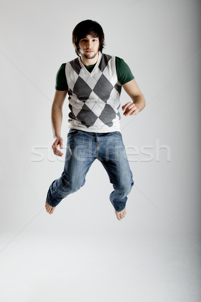 Dans atlama genç modern adam beyaz Stok fotoğraf © iko