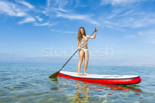 Woman practicing paddle Stock photo © iko