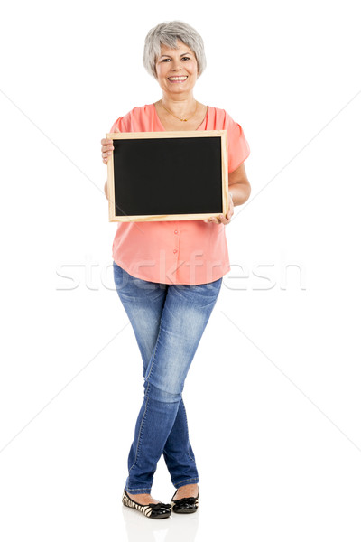 Old woman holding a chalkboard Stock photo © iko