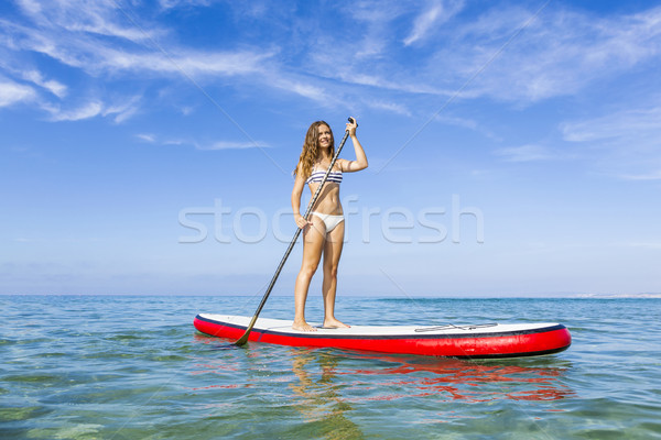 Woman practicing paddle Stock photo © iko