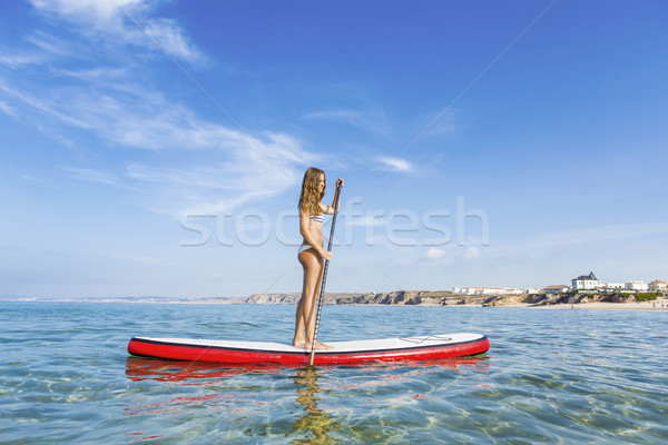 Woman practicing paddle Stock photo © iko