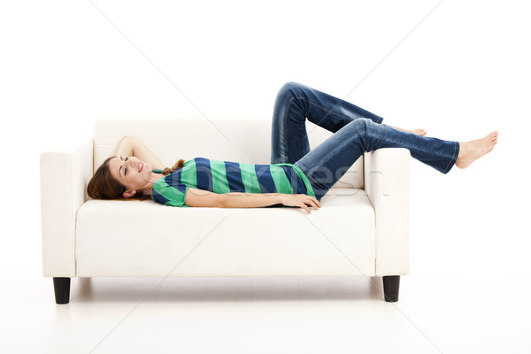 Kadın kanepe güzel bir kadın beyaz yalıtılmış ev Stok fotoğraf © iko
