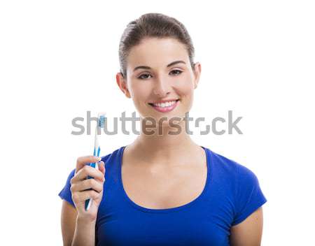 Beautiful woman with a toothbrush Stock photo © iko