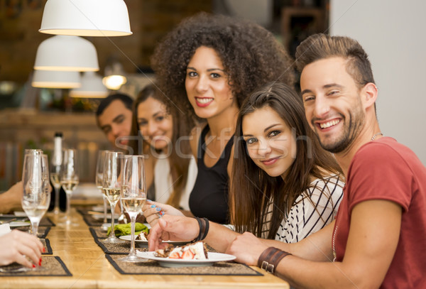 Friends lunching at the restaurant Stock photo © iko