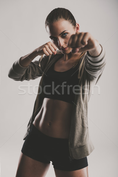 Czasu shot piękna młoda kobieta kickboxing Zdjęcia stock © iko