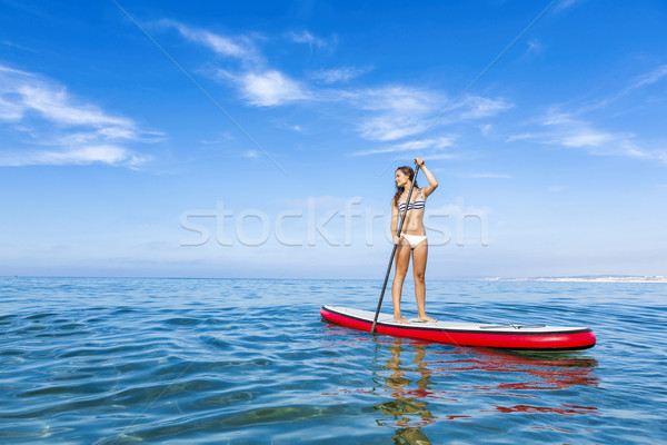 Woman practicing paddle Stock photo © iko