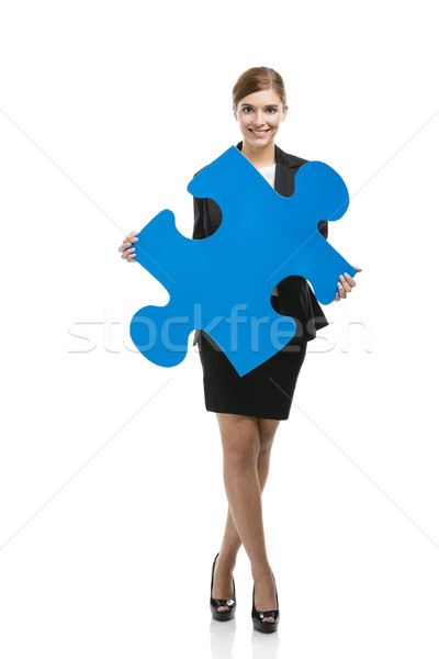 Businesswoman with a puzzle piece Stock photo © iko