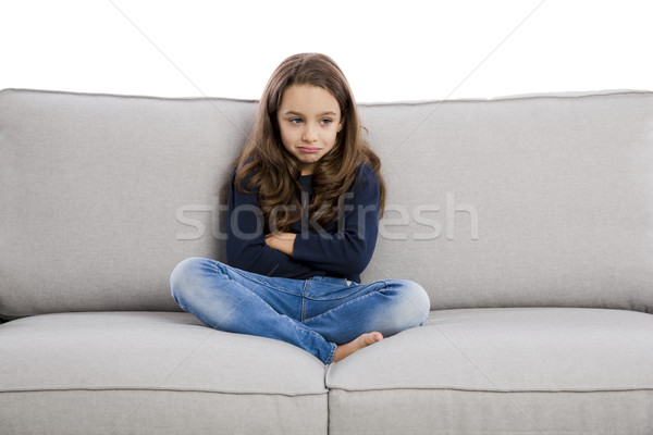 расстраивать девочку сидят диване что-то детей Сток-фото © iko