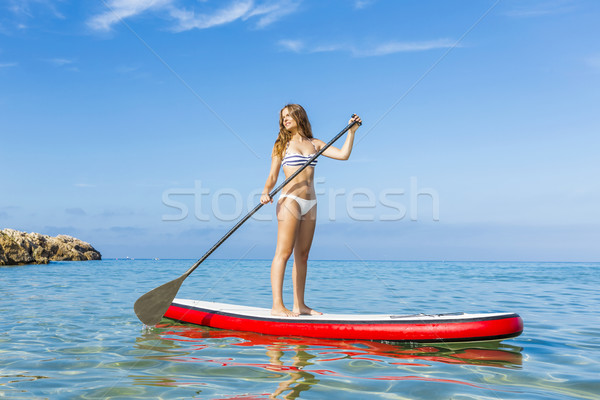 Woman practicing paddle Stock photo © iko