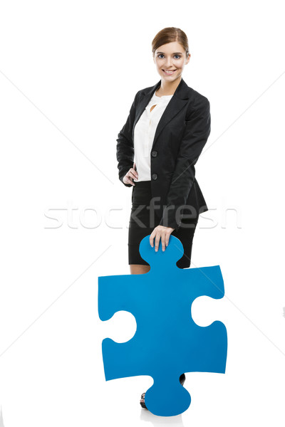 Businesswoman with a puzzle piece Stock photo © iko