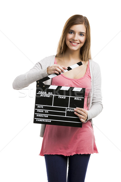 Beautiful girl holding clapboard Stock photo © iko