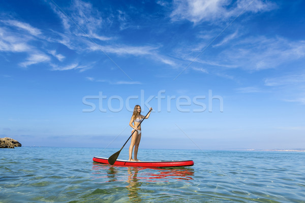 Woman practicing paddle Stock photo © iko