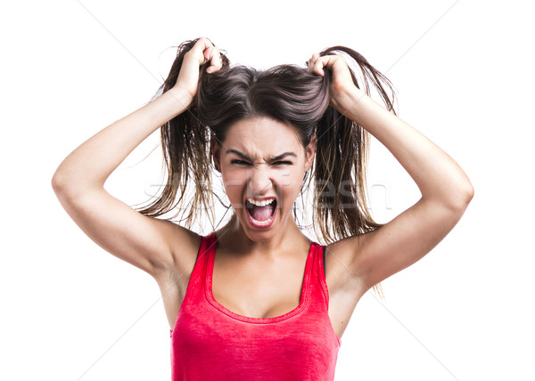 Woman grabbing her hair Stock photo © iko