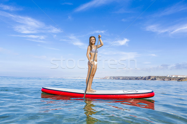 Woman practicing paddle Stock photo © iko